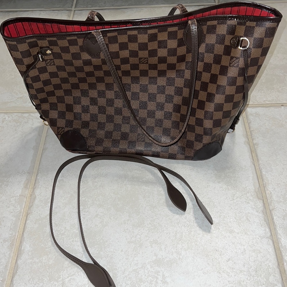 Original repaired Louis Vuitton never full hand bag